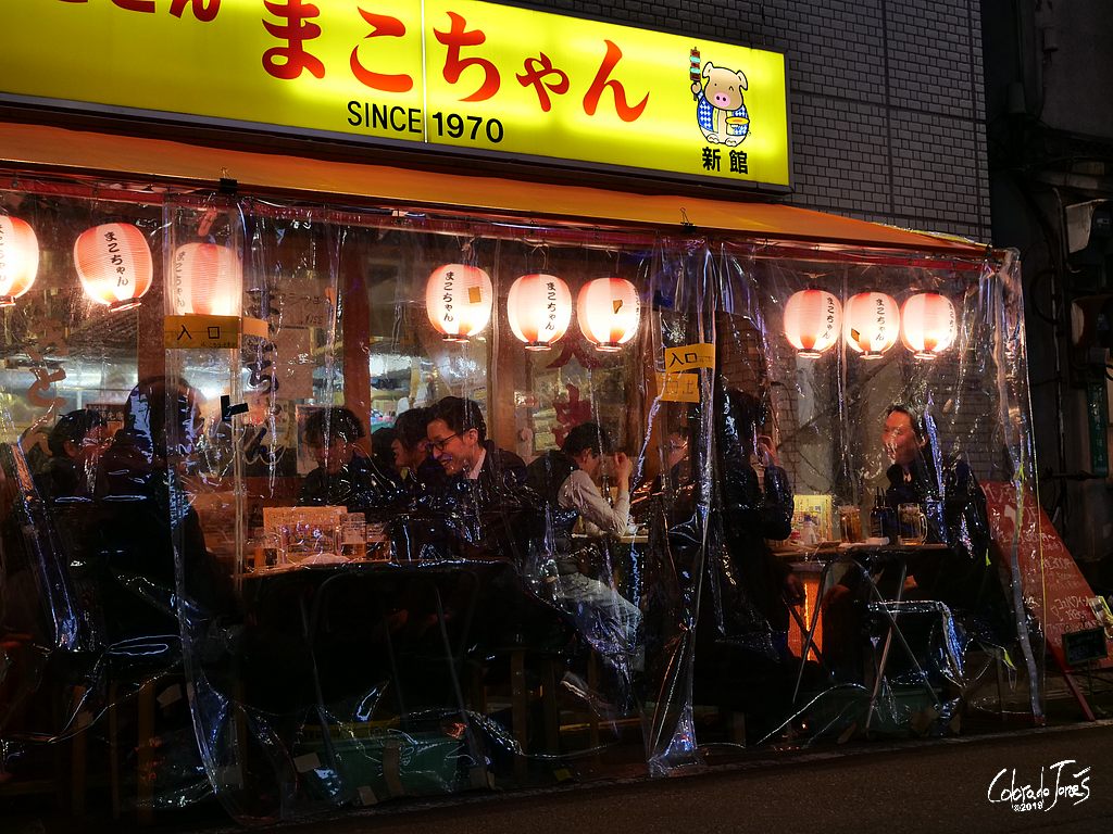 Businessmen in Shinbashi, Tokyo Japan enjoying a beer before heading home