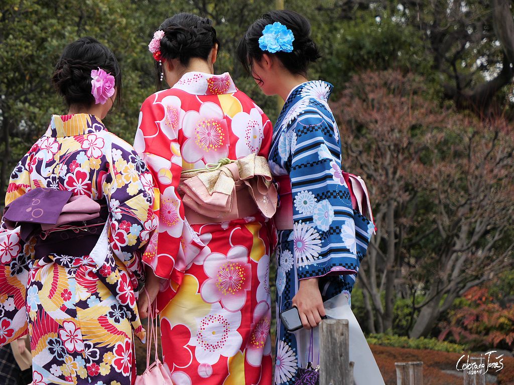 Three girls in beautiful Kimonos near Senso-Ji Temple in Tokyo Japan